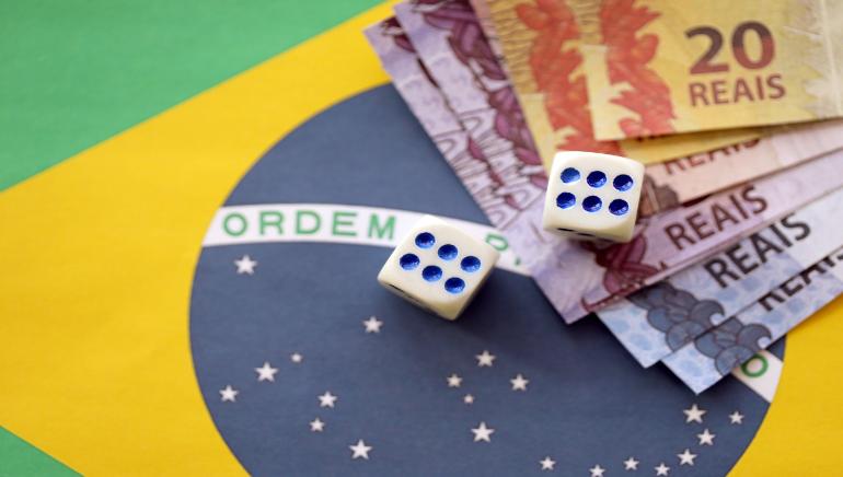 Brazil flag, gambling, money and dices.