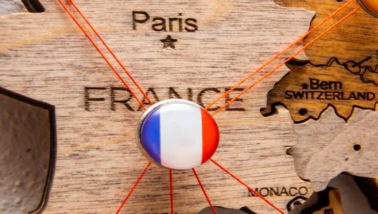France flag pinned on a map