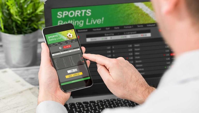 Mobile Sports Betting and Laptop